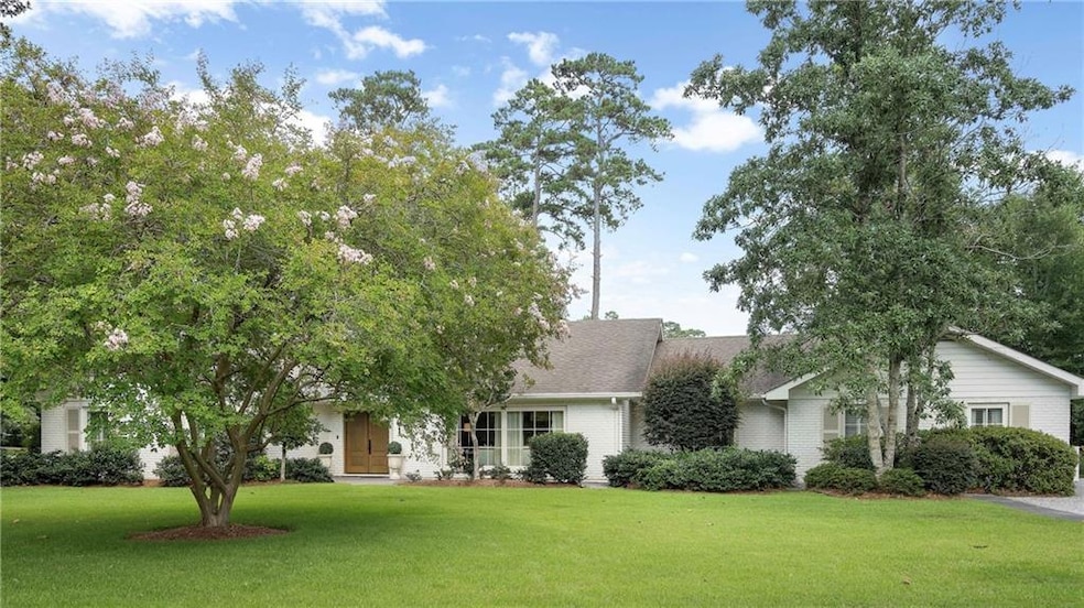 Charming updated brick ranch on an over 3/4 acre manicured lot.