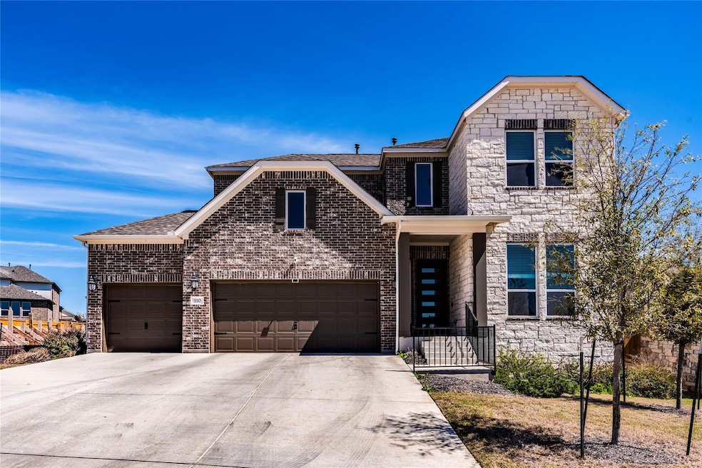 View of front of property featuring concrete driv