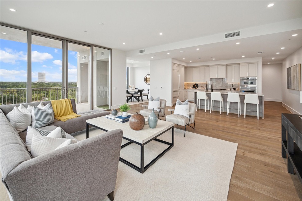 Floor-to-ceiling windows flood the room with natur