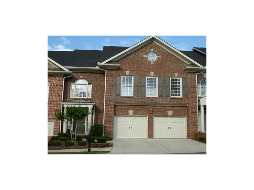 Exterior Front. Four sided brick.