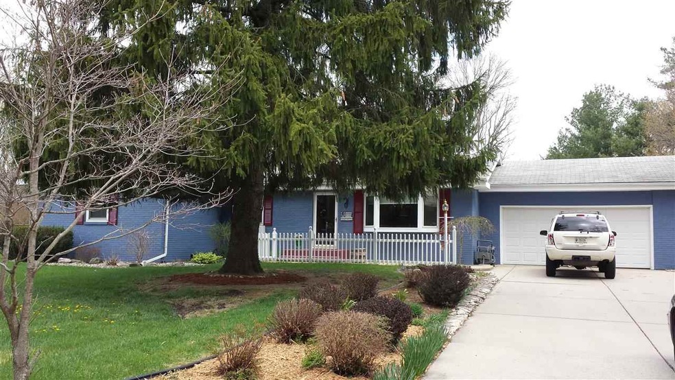 This home is on beautiful landscaped 1 acre lot wi