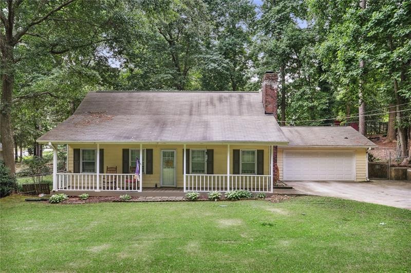 Beautiful covered porch is perfect for winding dow