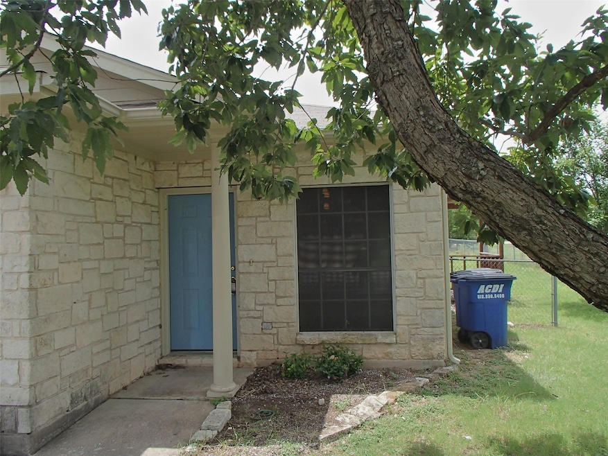Property entrance featuring stone siding