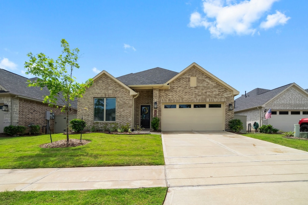 This charming brick home features a neatly manicur