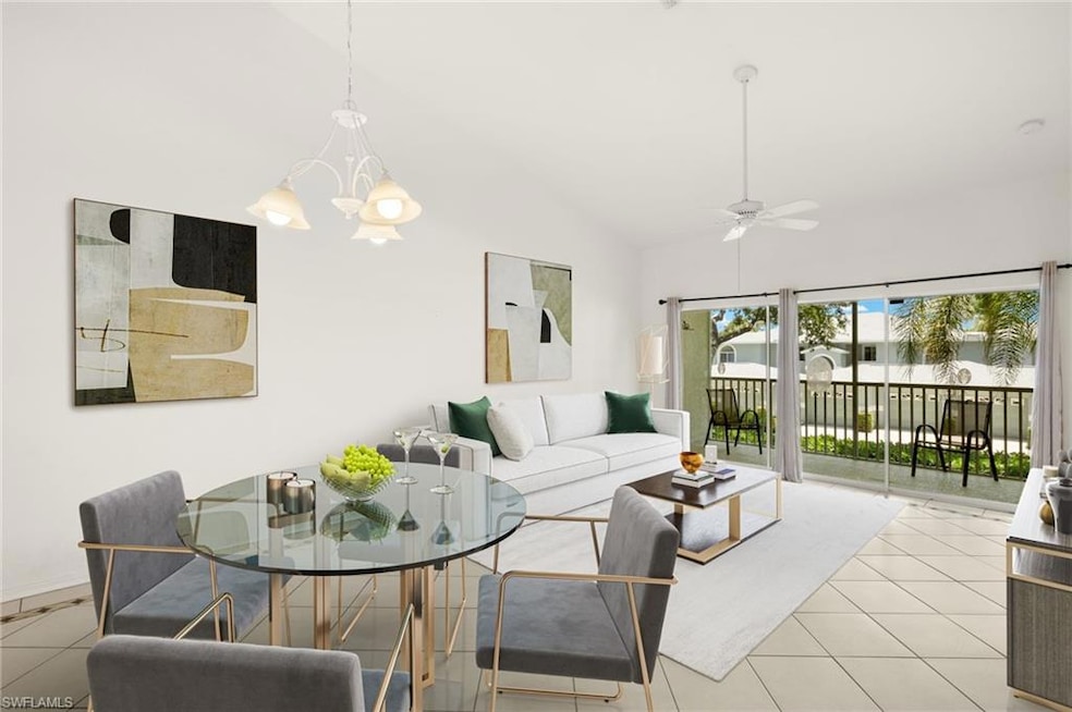 Virtually Staged Tiled Dining / living room featuring a chandelier, a ceiling fan, and high vaulted ceiling