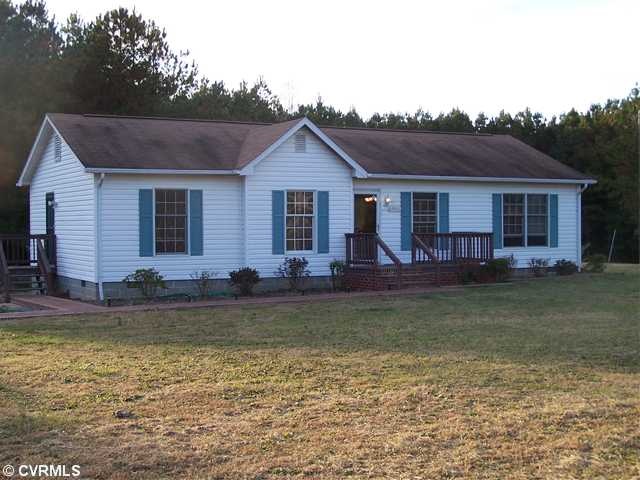 Exterior Front - private 1.13 acre lot, brick side