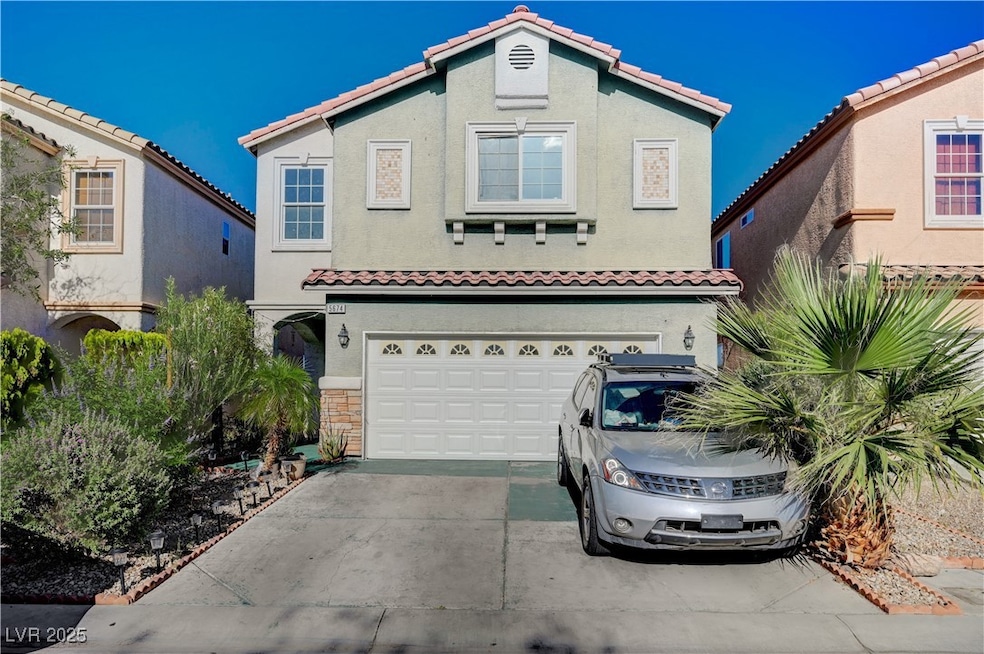 View of front of house featuring a garage, drivewa