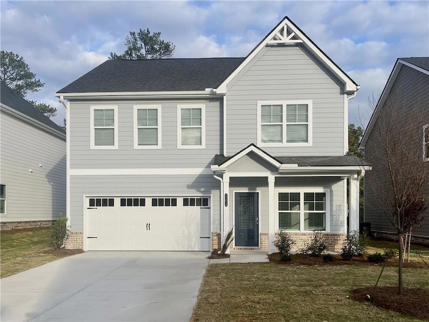 Craftsman-style home featuring a garage and a fron
