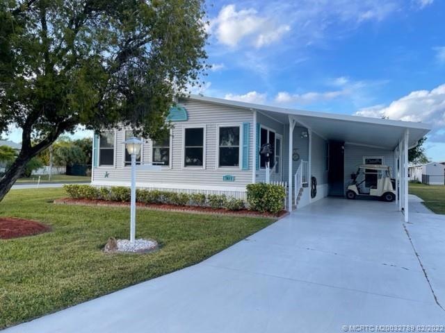Front view of home with extended driveway