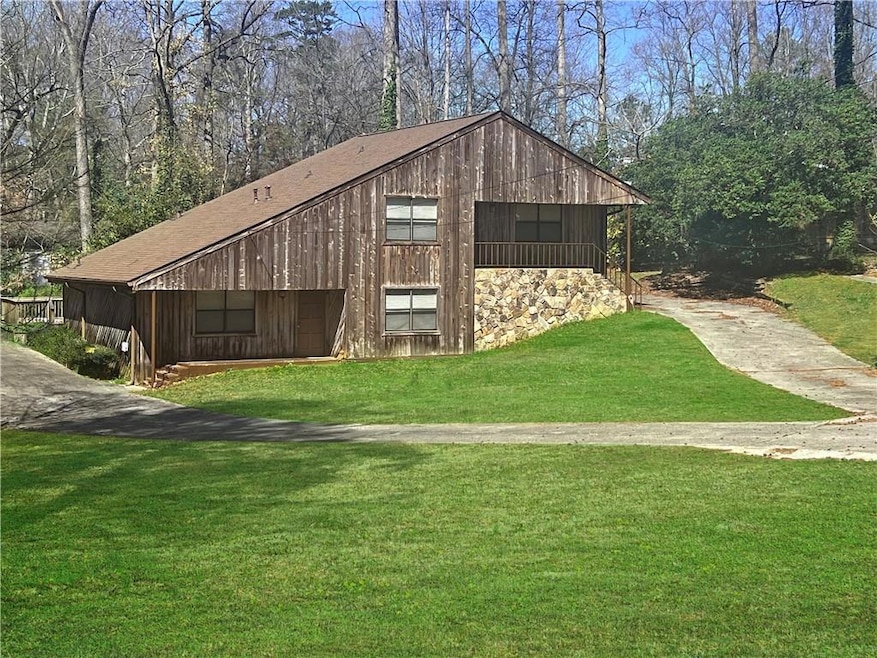 View of outbuilding featuring driveway