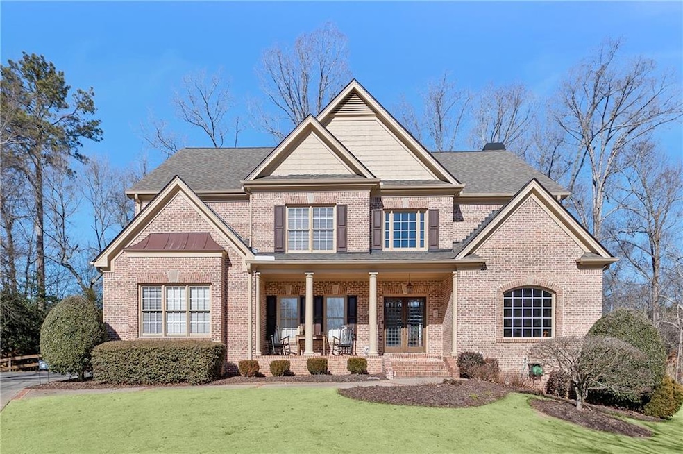 Craftsman-style home with a porch and a front lawn