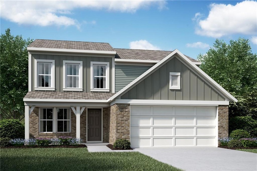 View of front facade with a garage and a front yar