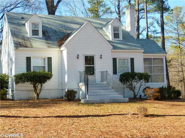 Exterior Front - Vinyl siding and aggregate walkwa