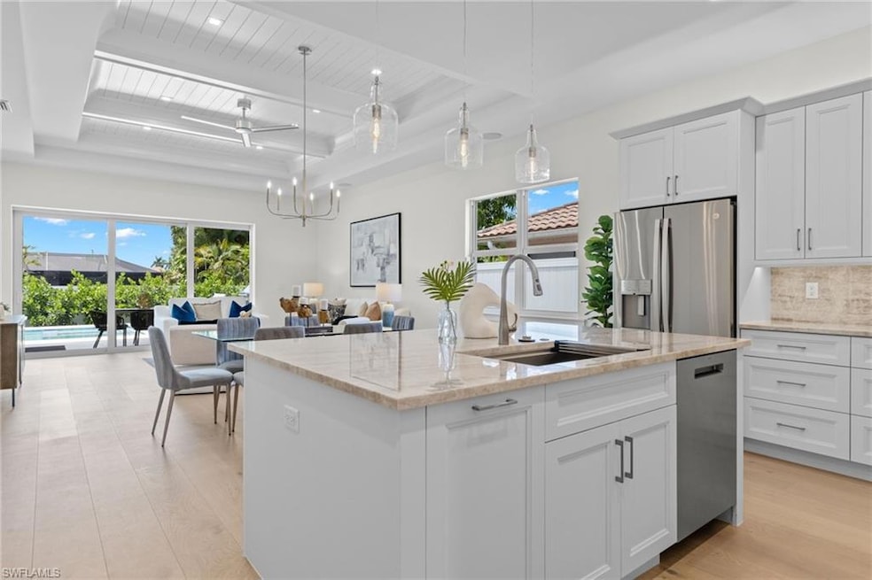 Kitchen with light hardwood / wood-style floors, t