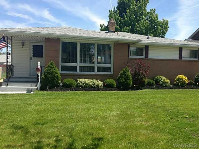 Exterior Front. Brick and vinyl, roof is updated, 