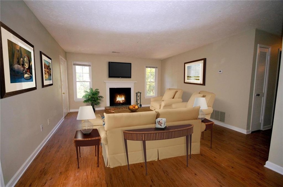 Living room featuring dark hardwood / wood-style f