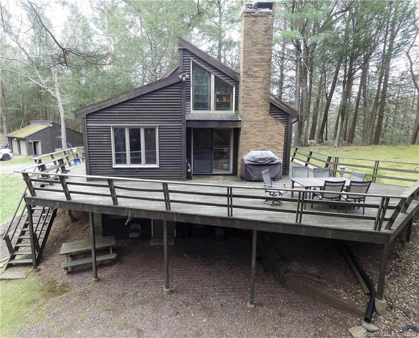 Side view of home with wrap around porch.