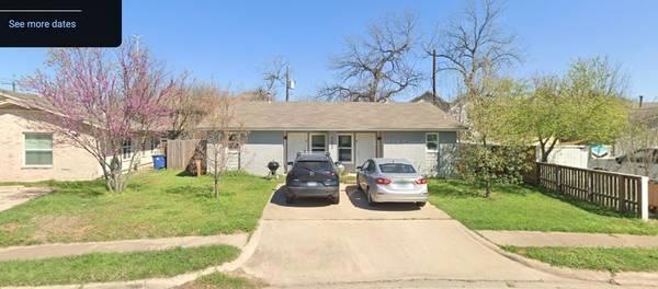 View of front of house with fence, a front lawn, 