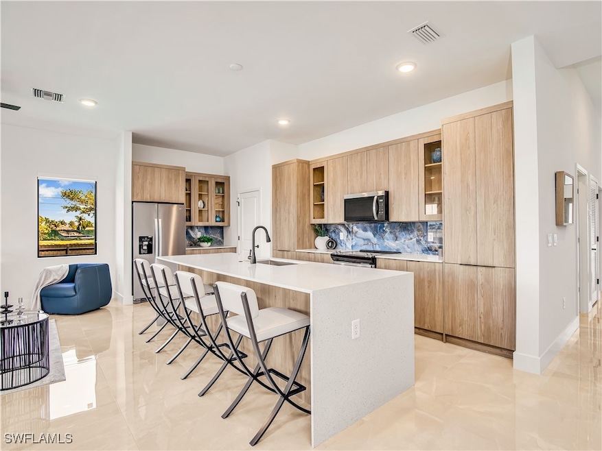 Kitchen featuring stainless steel appliances, mode