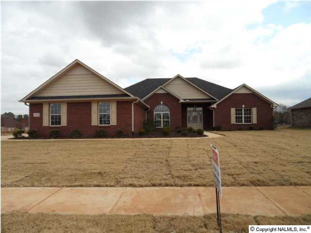 Front view of all brick - 3 car garage home in Newby Plantation.