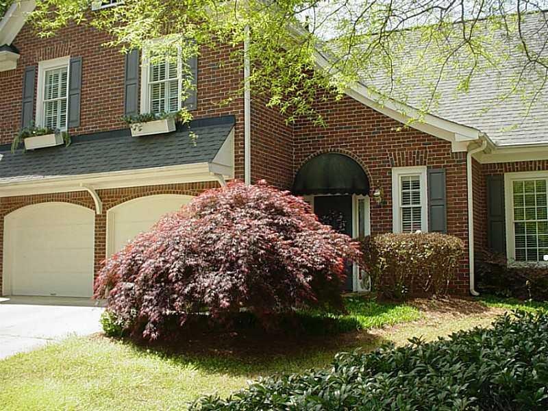 Exterior Front. Beautiful three-sided brick home o