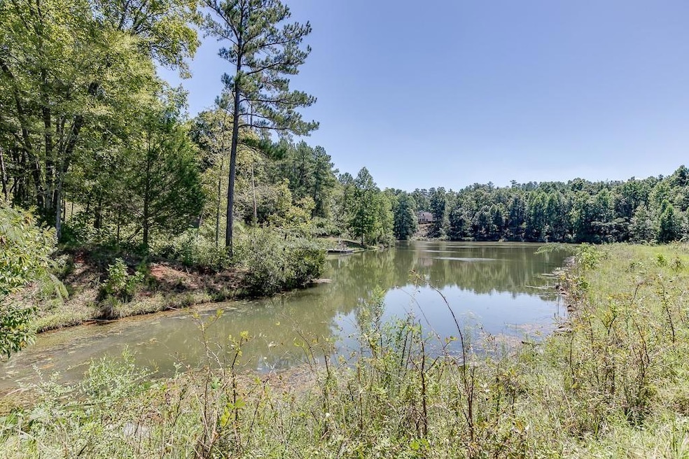 View of water feature featuring a wooded view