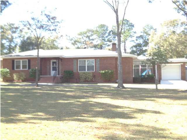 House is constructed with brick and vinyl.