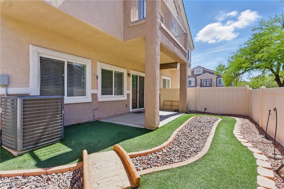 View of yard featuring cooling unit, a patio area,