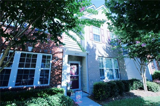 Beautiful entrance with covered porch and sidewalk