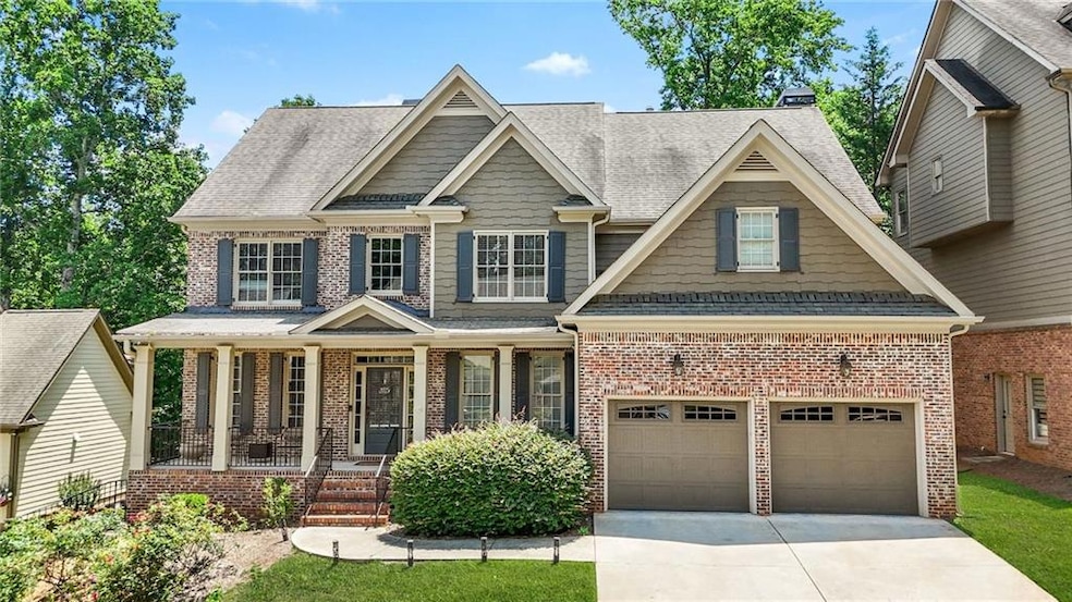 Craftsman-style home with concrete driveway, covered porch, brick siding, and roof with shingles