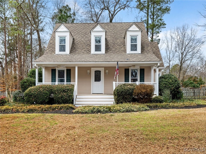 New england style home with covered porch and a fr