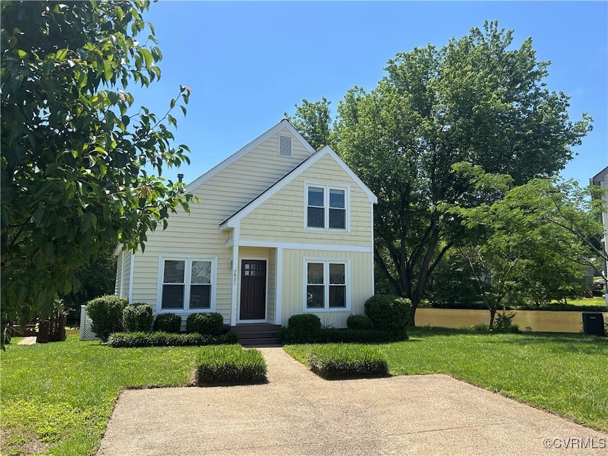 Traditional-style home with a front yard and board