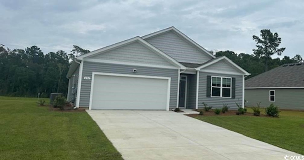 View of front facade featuring a garage and a fron