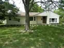 Summer view of the home shows the great shade prov