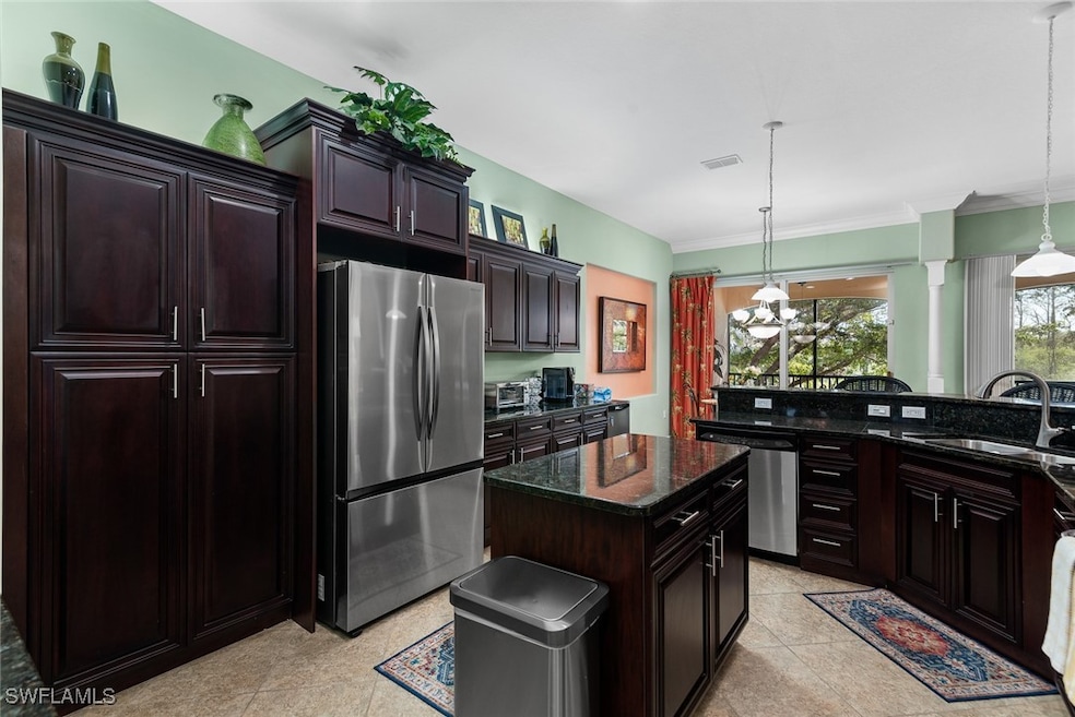 Kitchen with stainless steel appliances, a sink, v