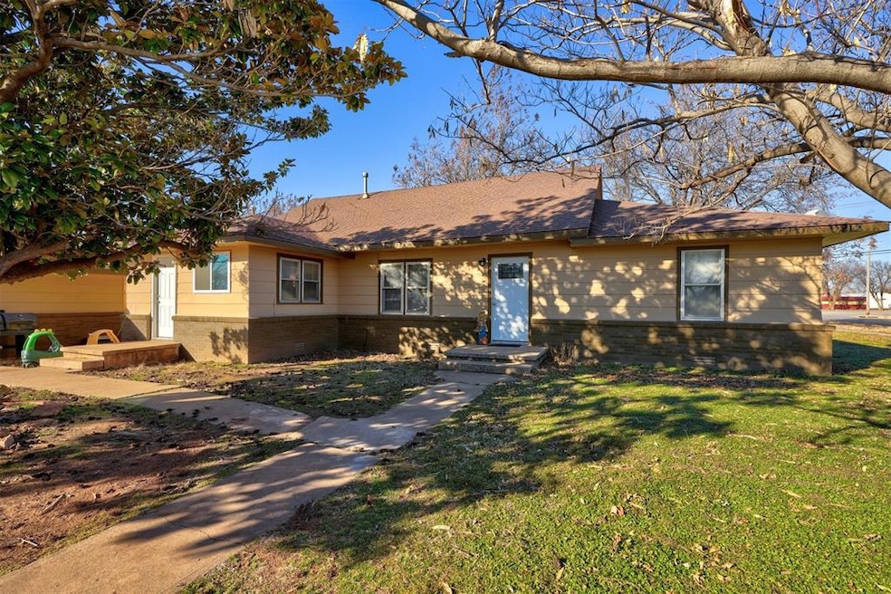 Ranch-style home with a front yard