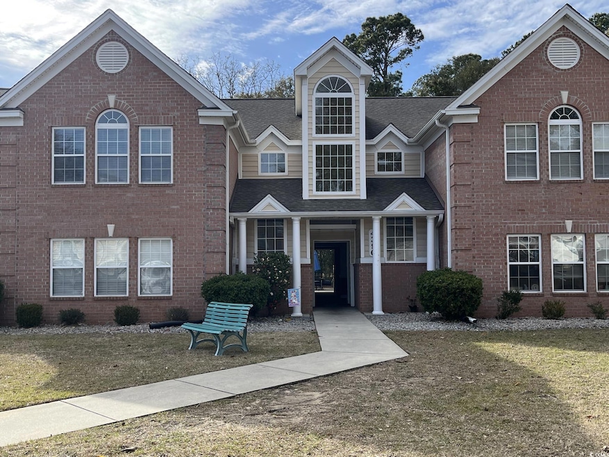 Traditional-style house with brick siding, a shing