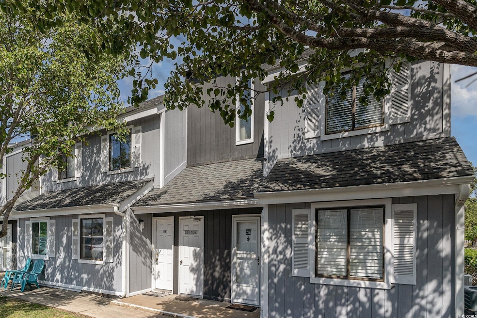 View of front facade featuring a shingled roof