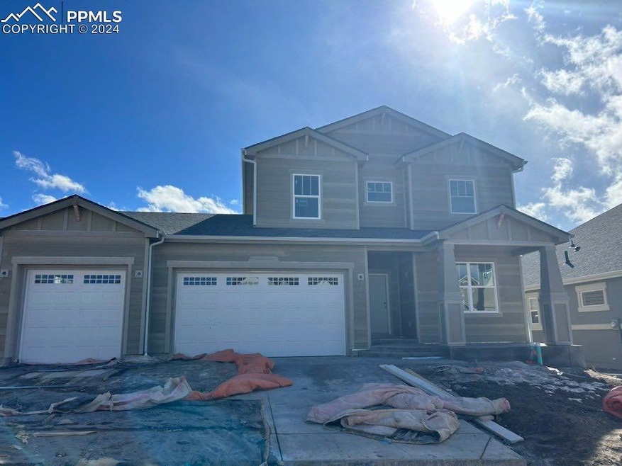 View of front of home featuring a garage