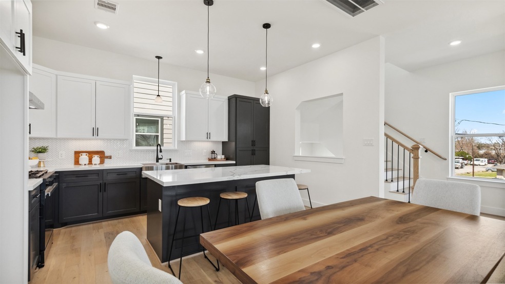 This modern kitchen features sleek black and white
