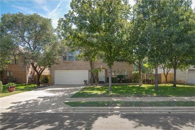 Well-shaded front of home with large back yard.