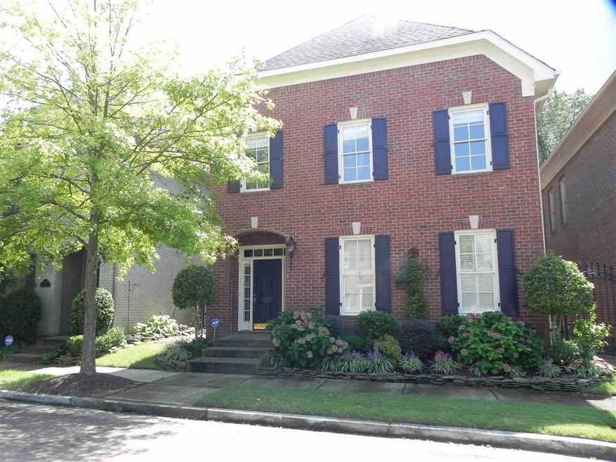 This magnificent brick home in the exclusive subdi