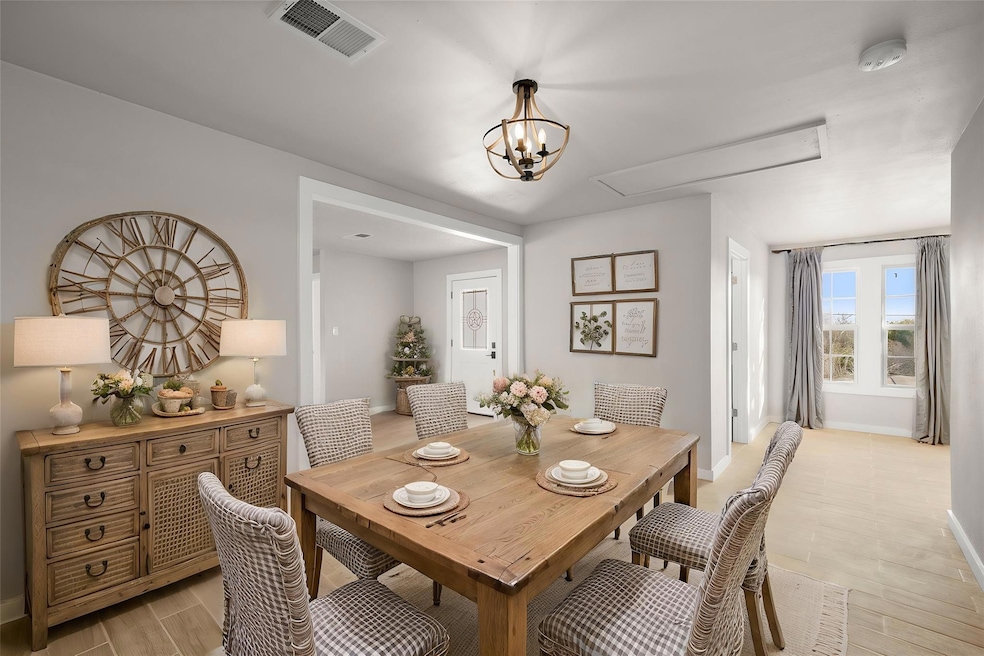 Dining room with light wood finished floors, atti