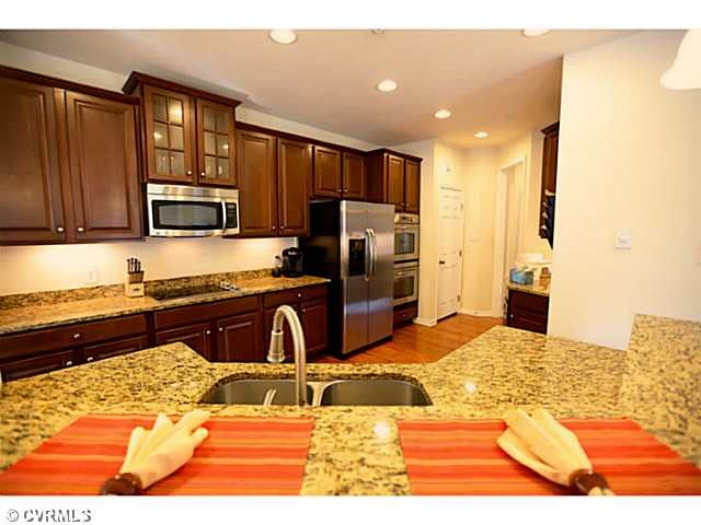 Kitchen - Upgraded kitchen features double ovens, 