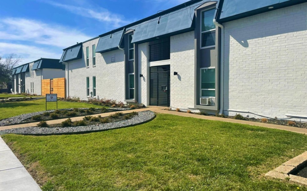 Entrance to property featuring a lawn