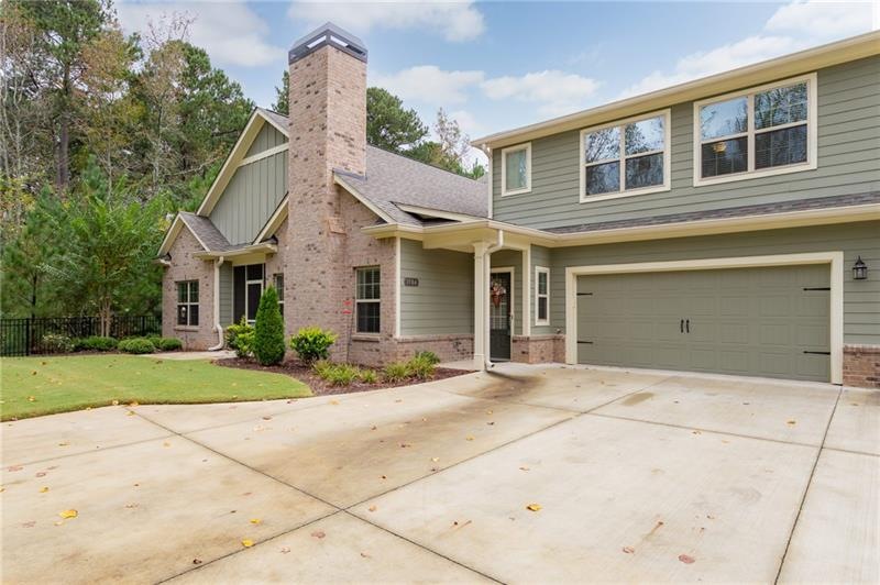 STUNNING CUSTOM FLOOR PLAN NESTLED ON PRIVATE WOOD