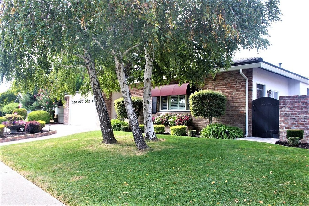Incredible landscaping surrounds this beautiful ho
