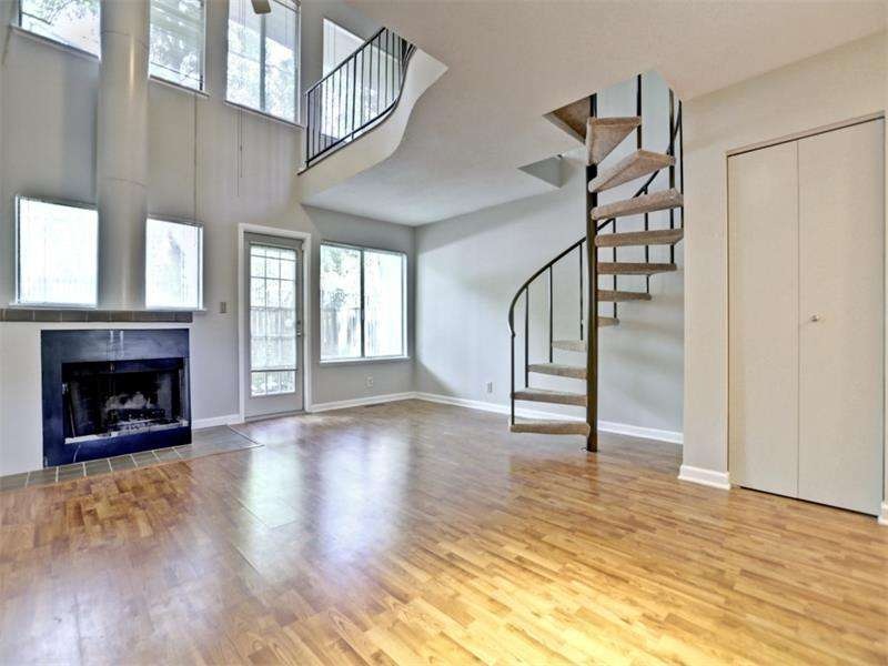 2 story open great room with wall of windows and a