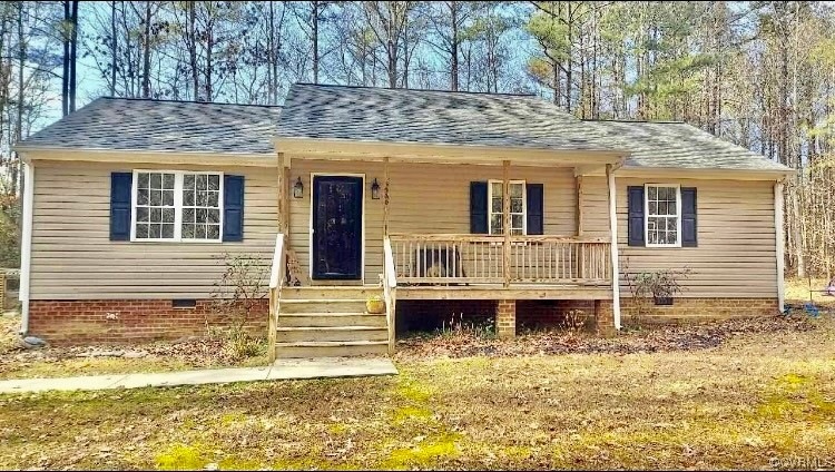 Single story home with a porch