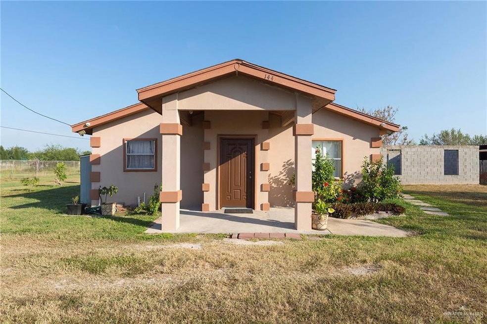 Front of Home: A charming view of the front of the home, featuring a welcoming front porch with light brown and beige accents that highlight the entrance.
